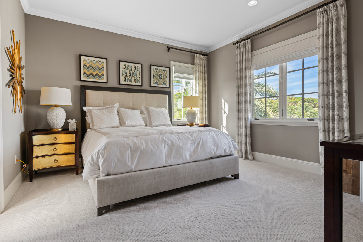 bedroom with grey and white decor with gold accents